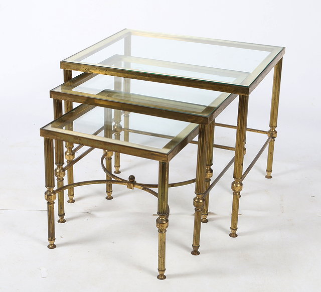 Appraisal: A NEST OF THREE BRASS FRAMED LOW OCCASIONAL TABLES with