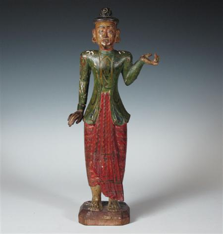 Appraisal: A South East Asian polychrome painted wood figure of a