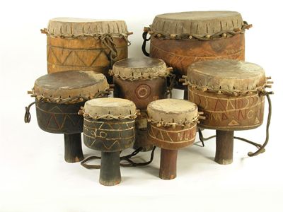 Appraisal: Two carved wood and hide covered drums