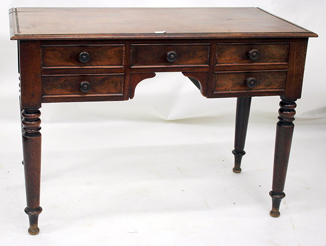 Appraisal: AN EARLY VICTORIAN MAHOGANY KNEEHOLE WRITING DESK fitted five drawers