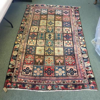 Appraisal: A Bakhtiari rug the geometric floral field to a multiple