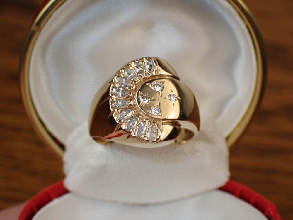 Appraisal: DIAMOND AND FOURTEEN KARAT GOLD RING set with four round-cut