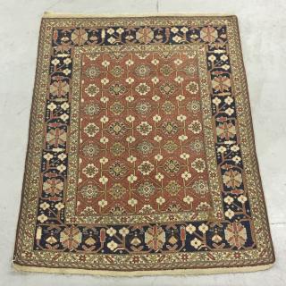 Appraisal: Caucasian Mat with Red Field and Floral Rosette Caucasian mat