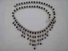 Appraisal: A white metal tests silver sapphire fringe necklace approx cm