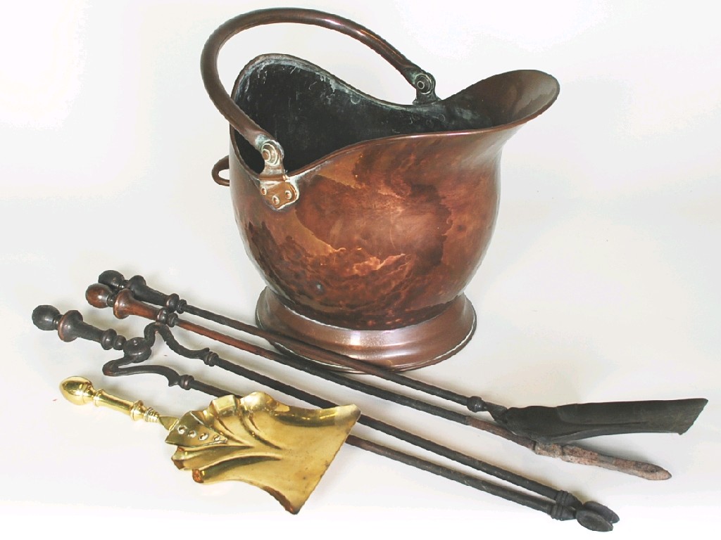 Appraisal: HELMET SHAPED COPPER COAL SCUTTLE with matched shovel and a