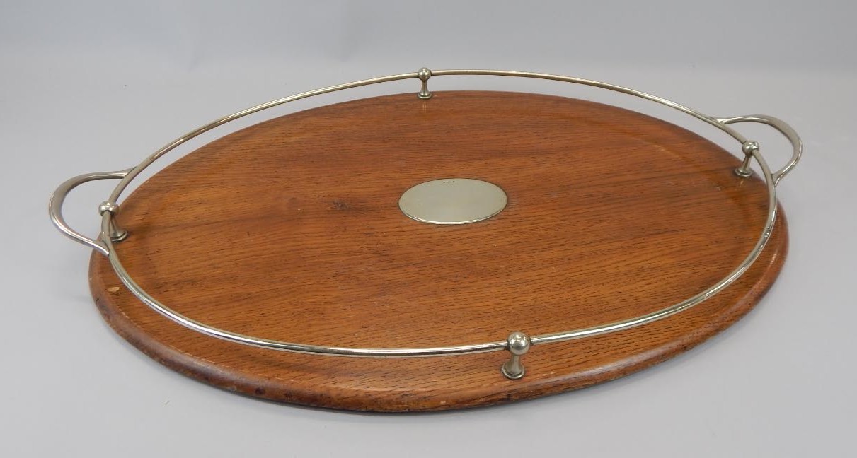 Appraisal: An early thC oak two handled tray with silver plated