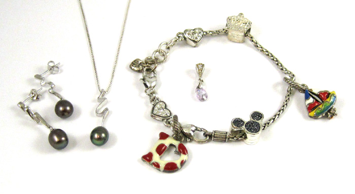 Appraisal: FIVE ARTICLES OF SILVER JEWELRY including an inch charm bracelet