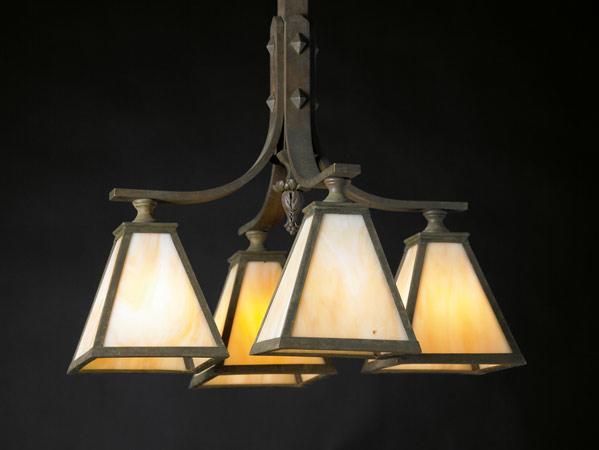 Appraisal: ARTS CRAFTS LIGHTING Hanging chandelier with four flaring lanterns lined