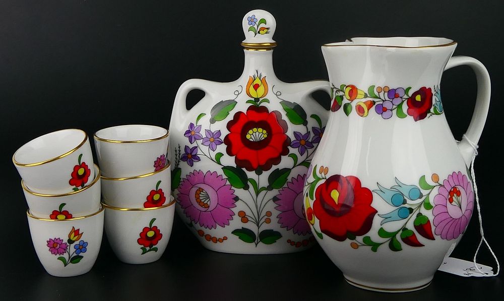 Appraisal: KOLASCO HUNGARIAN PIECE WINE SET Porcelain covered flask pitcher and