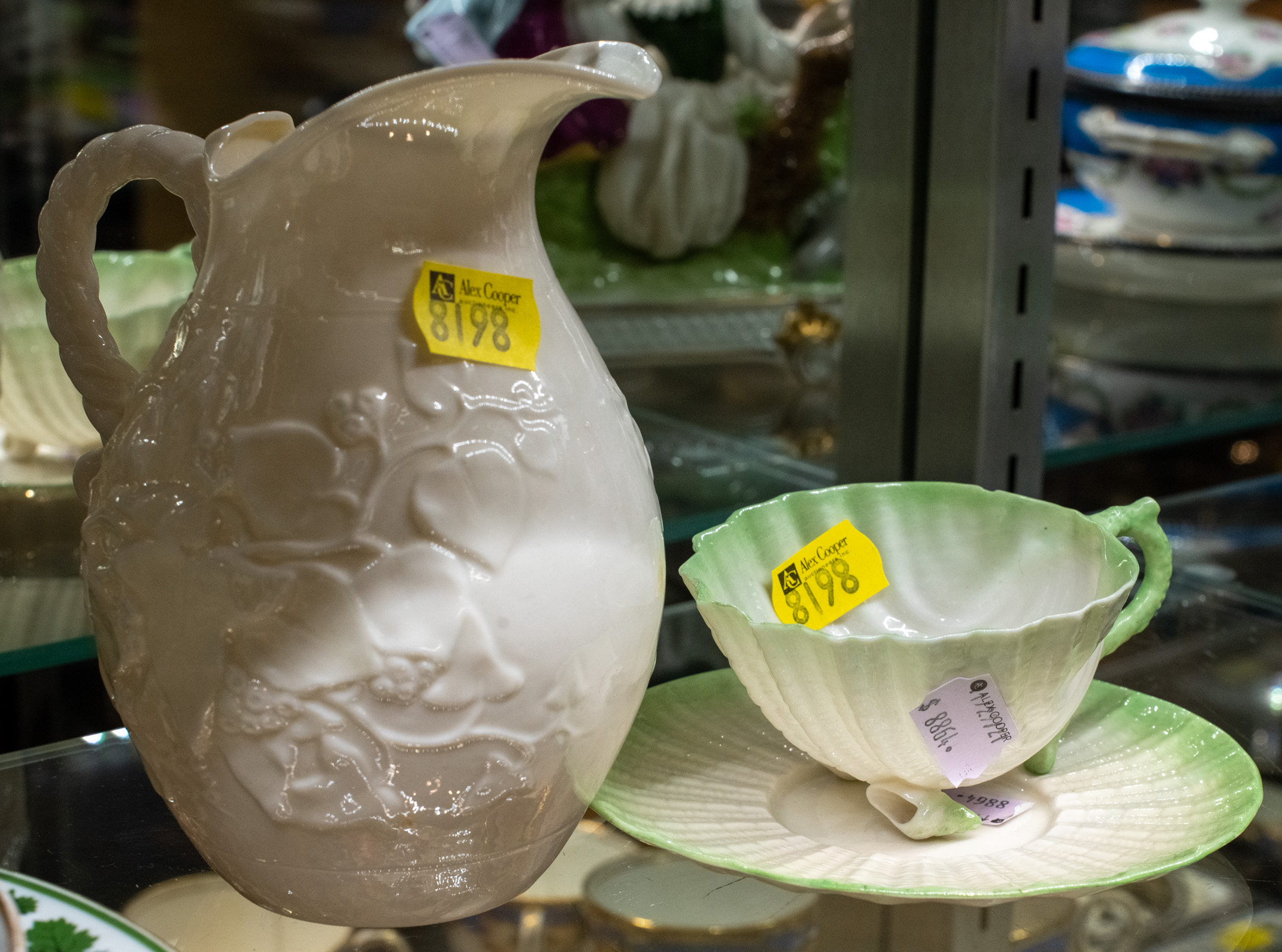 Appraisal: THREE PIECES OF BELLEEK Includes a jug with molded ivy