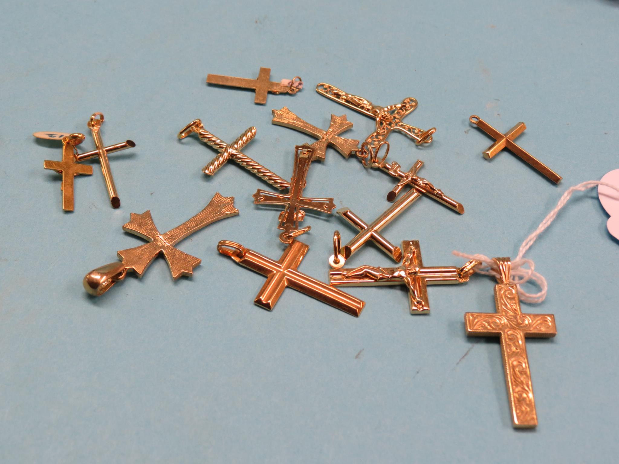 Appraisal: Six ct gold crucifix pendants and eight ct gold cross