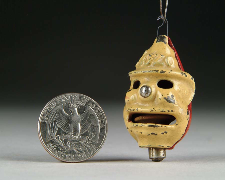 Appraisal: BOZO RED TOY CAP BOMB BOMB Manufacturer unknown Circa Enameled