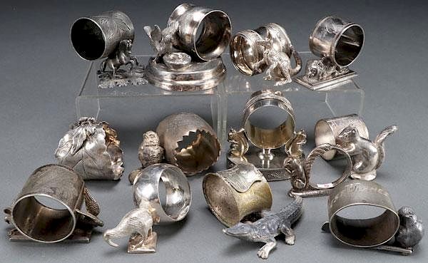 Appraisal: VICTORIAN SILVERPLATE FIGURAL NAPKIN RINGS A COLLECTION OF MOSTLY VICTORIAN