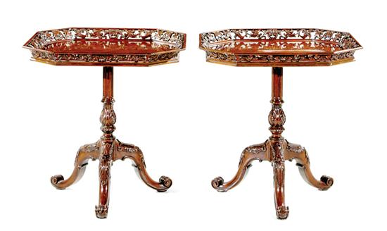 Appraisal: Pair Chippendale style carved mahogany tea tables floral-pierced gallery surrounding