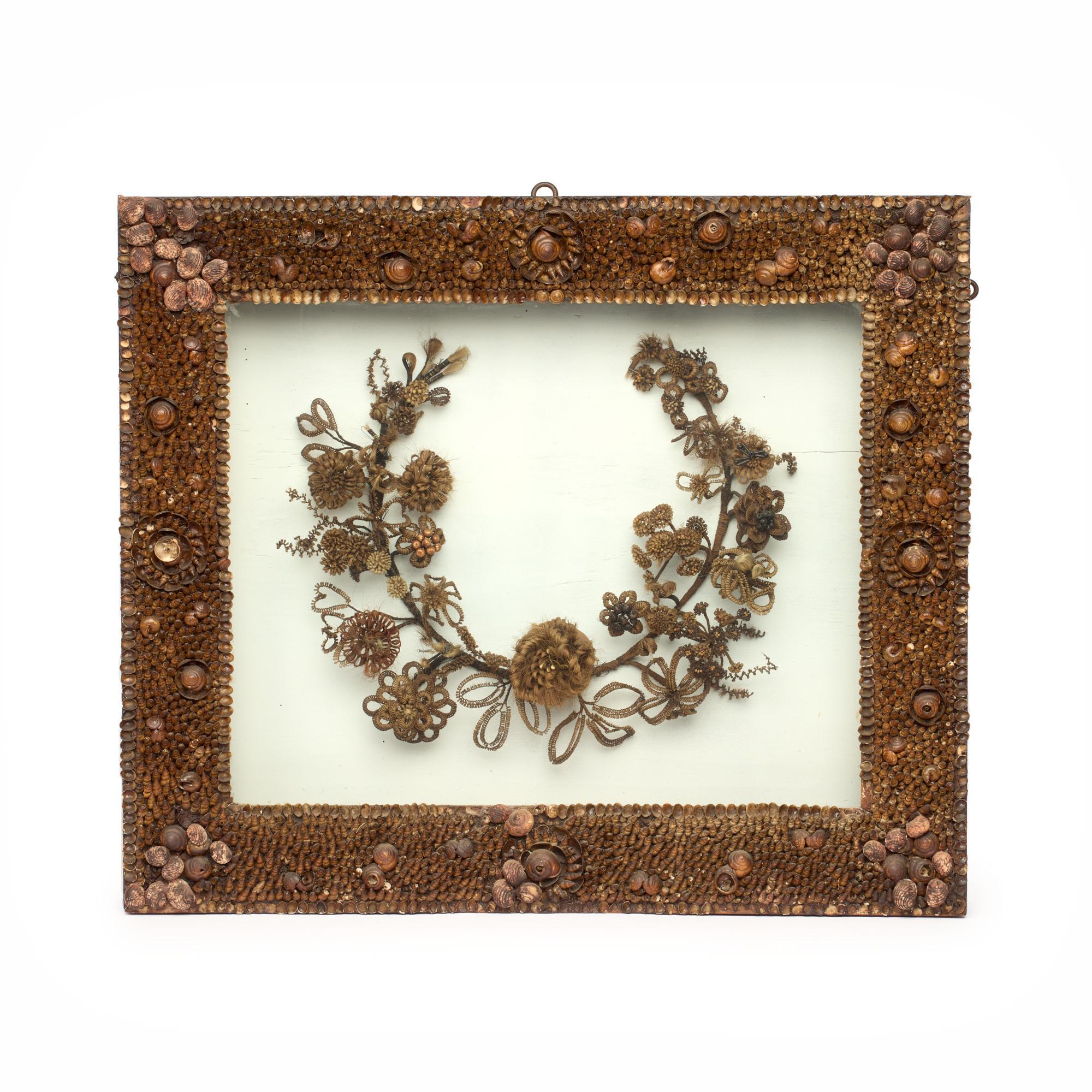 Appraisal: HAIR WREATH IN LARGE SHELLWORK SHADOWBOX CA A braided hair