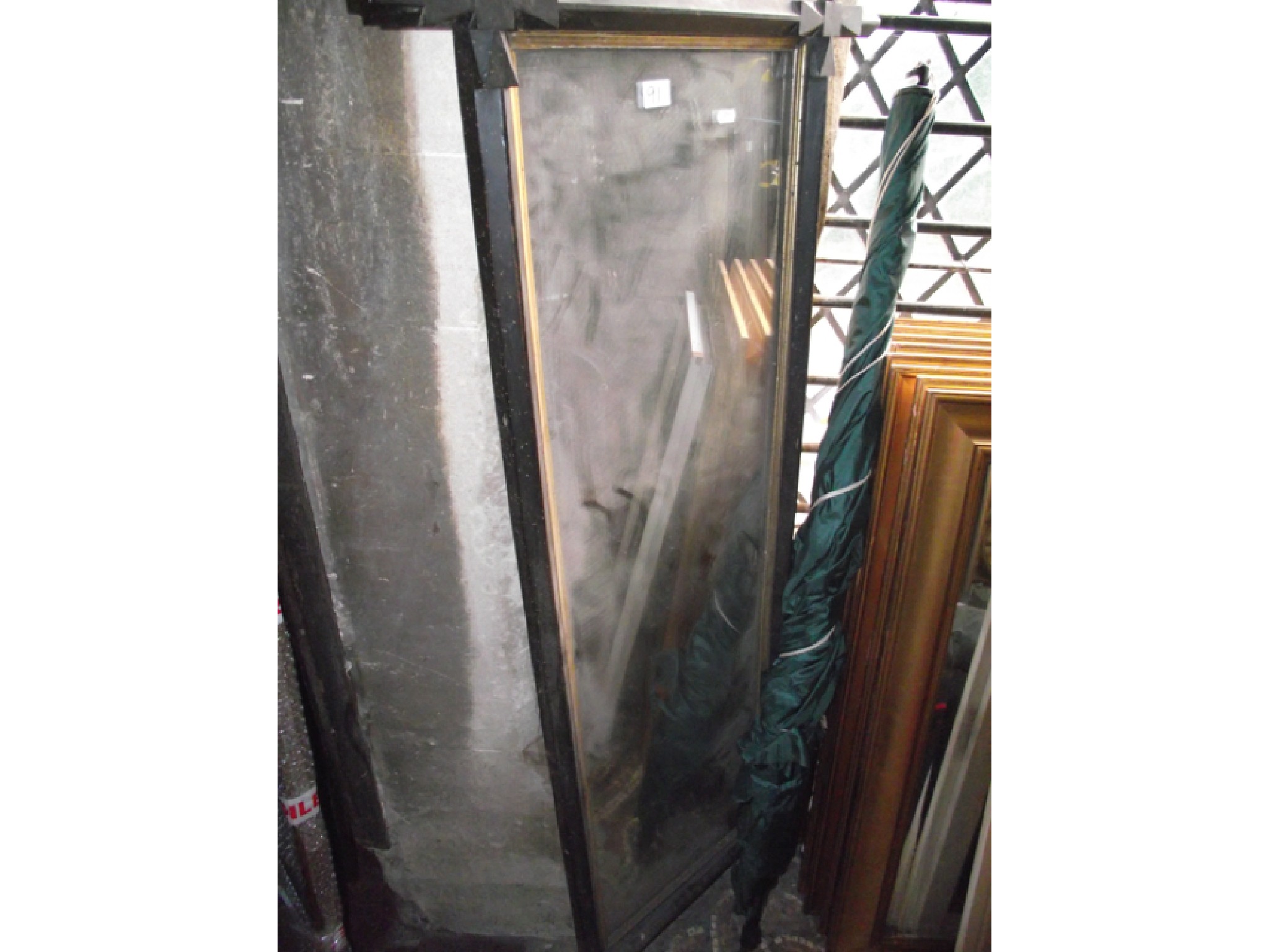 Appraisal: A Victorian wall mirror the ebonised Oxford type frame with