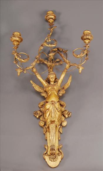 Appraisal: A pair of giltwood and composition three branch figural wall