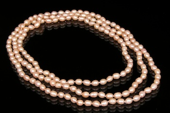 Appraisal: Freshwater Cultured Peach Color Pearl Rope Necklace One long rope