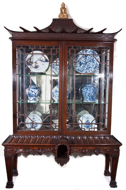 Appraisal: A CHINESE CHIPPENDALE STYLE MAHOGANY DISPLAY CABINET enclosed by two