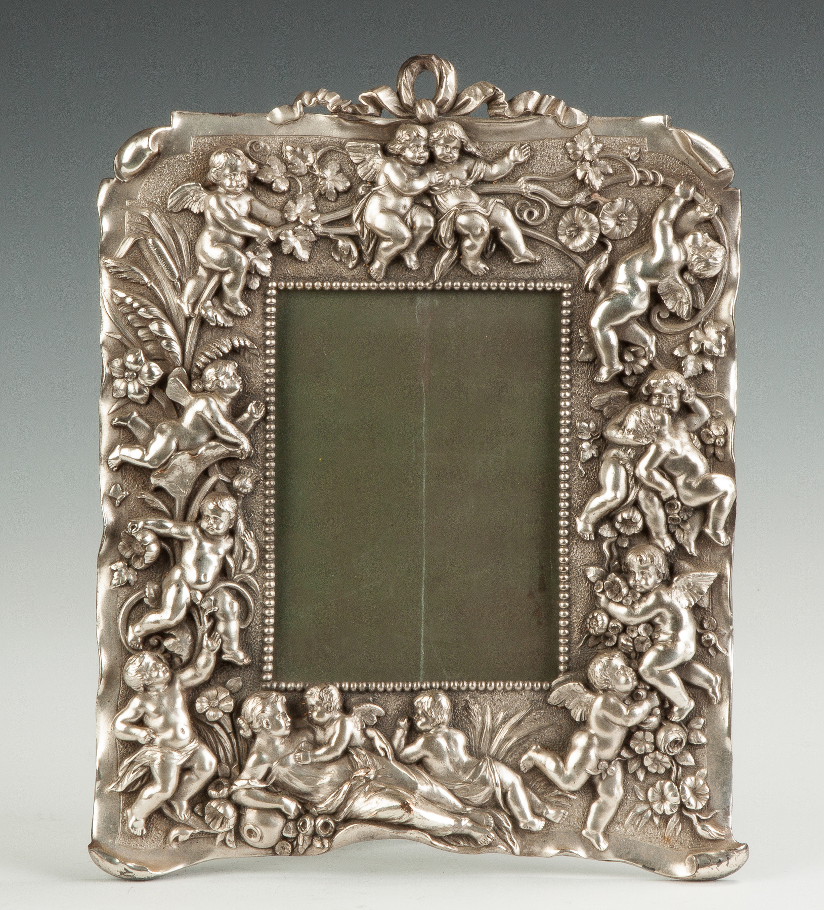 Appraisal: Victorian Silver Plate Frame th cent With cherubs and reclining