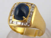 Appraisal: A yellow metal tests carat gold cabochon sapphire and baguette