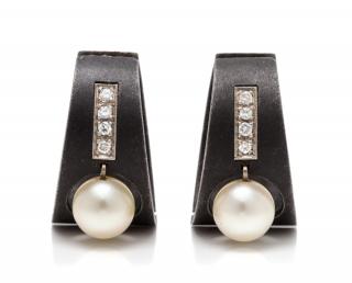 Appraisal: A Pair of Art Moderne Blackened Steel White Gold Cultured