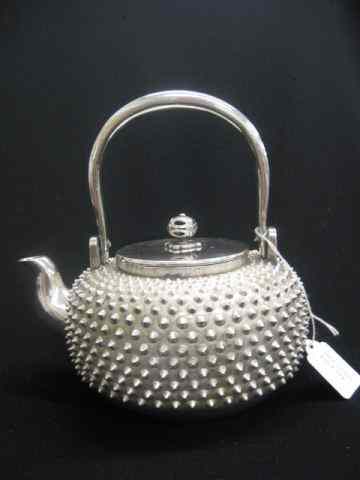 Appraisal: Chinese Silver Teapot overall studded design signed swing handle ''