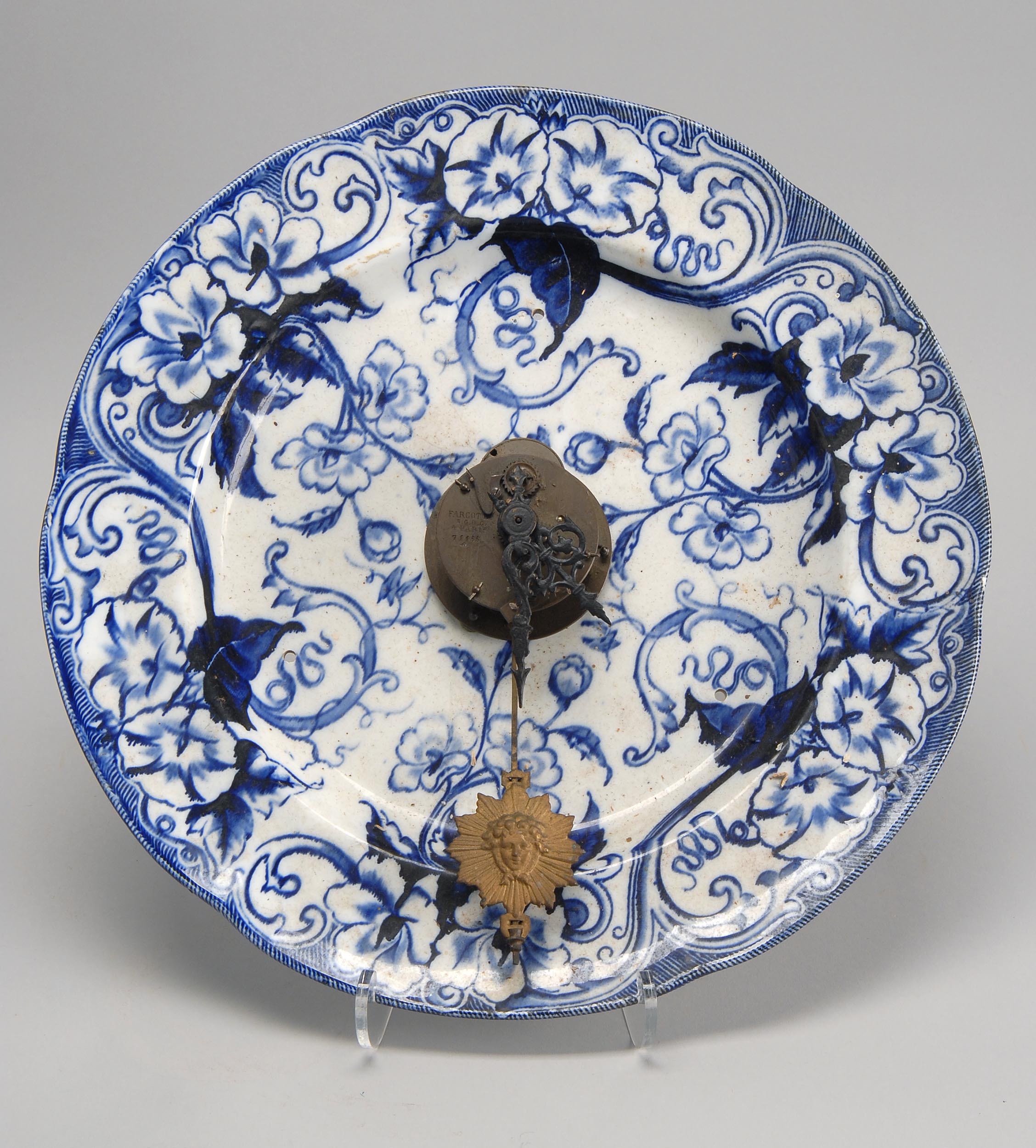 Appraisal: FLOW BLUE PORCELAIN CHARGER converted to a clock Diameter ConditionDrilled