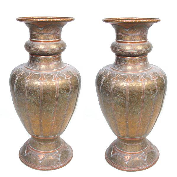 Appraisal: A pair of Middle Eastern large brass urns height in