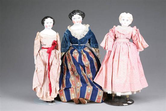 Appraisal: THREE CHINA HEAD DOLLS A blonde in a pink dress