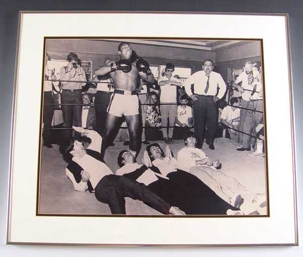 Appraisal: SIGNED MOHAMMED ALI THE BEATLES PHOTO Mohammed Ali autographed in