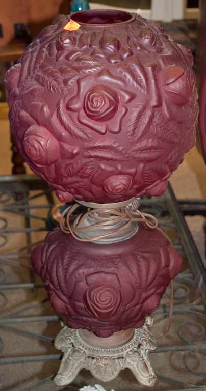 Appraisal: Victorian molded ruby glass lamp with rose relief decoration electrified