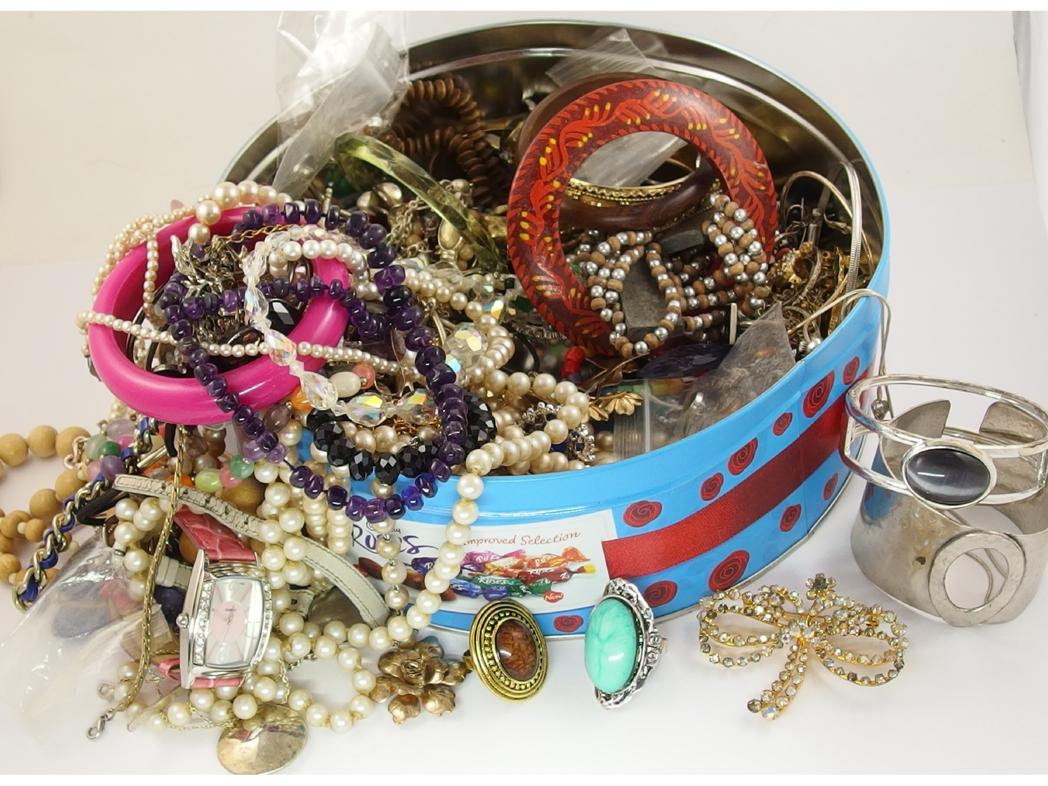 Appraisal: A tin full of costume jewellery watches brooches amethyst beads