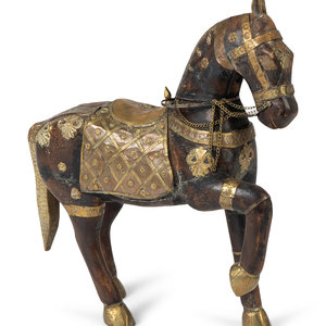 Appraisal: A Moroccan Carved Wood and Brass Horse TH CENTURY Height