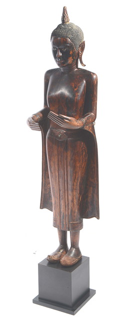 Appraisal: A LARGE CARVED THAI FEMALE BUDDHA standing on an ebonised