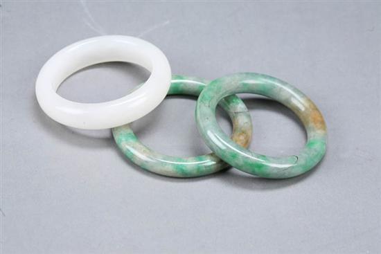 Appraisal: TWO PIECES OF JEWELRY China th century jadeite Carved bracelet