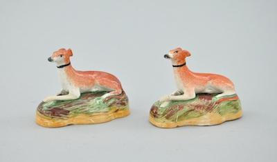 Appraisal: A Pair of Staffordshire Whippet Figurals The majestically poised dogs