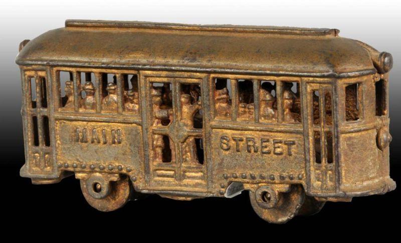 Appraisal: Cast Iron Main Street Trolley Car Still Bank Description Original