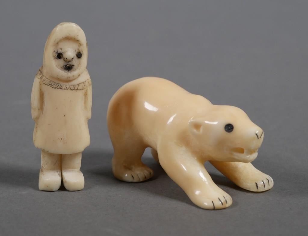 Appraisal: Two vintage hand carved ivory sculptures of an Eskimo and