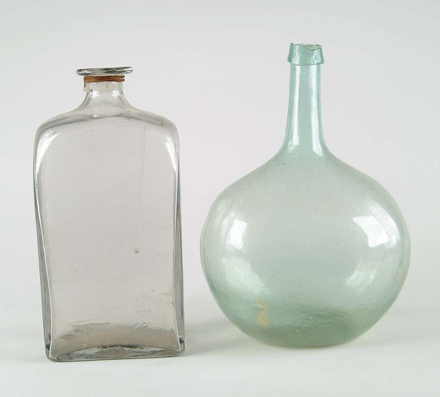 Appraisal: TWO BOTTLES Clear square decanter aqua Chestnut style bottle Sheered