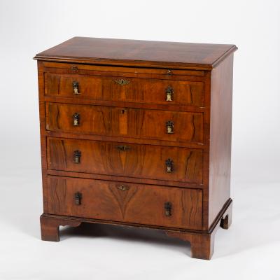 Appraisal: A walnut chest circa of four drawers with brushing slide