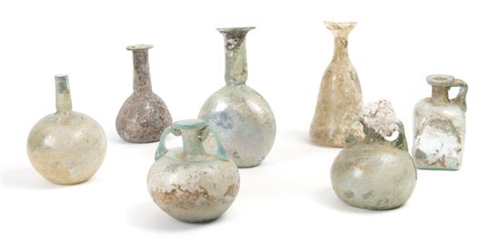 Appraisal: A Collection of Seven Roman Glass Bottles and Flasks Height