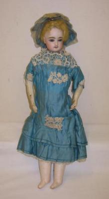 Appraisal: A bisque shoulder head fashion doll with fixed blue glass