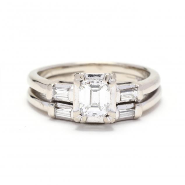 Appraisal: WHITE GOLD AND DIAMOND RING Centered on an emerald cut