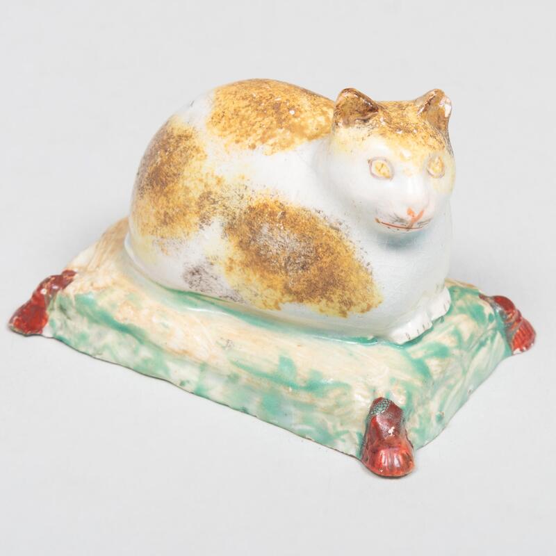 Appraisal: Staffordshire Model of a Recumbent Cat Unmarked x x in