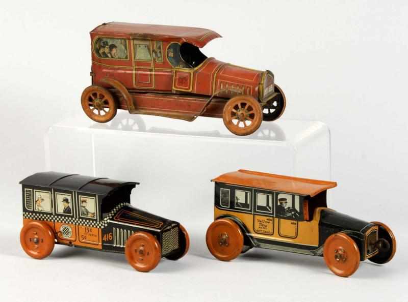 Appraisal: Lot of Tin Litho Vehicle Toys Description American Working Includes