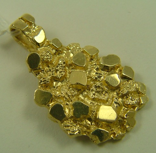 Appraisal: FOURTEEN KARAT GOLD PENDANT The - gold nugget pendant weighs