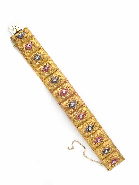 Appraisal: A ruby sapphire diamond and eighteen karat yellow gold bracelet