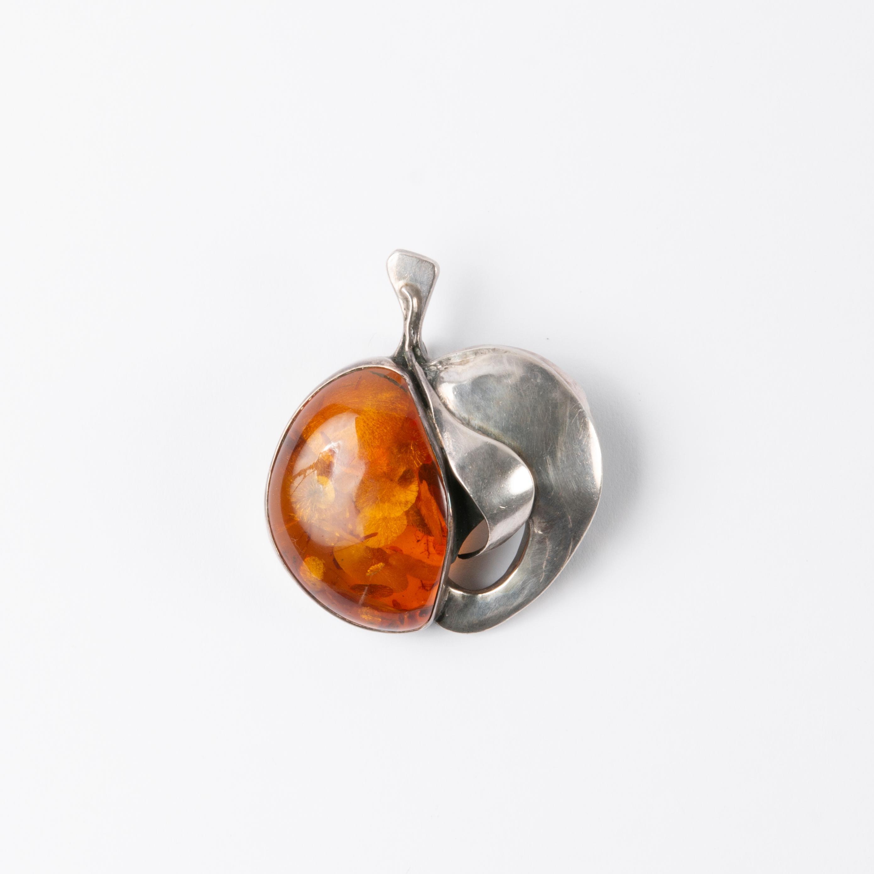 Appraisal: LARGE STERLING AMBER PEACH PENDANT A large sterling and amber