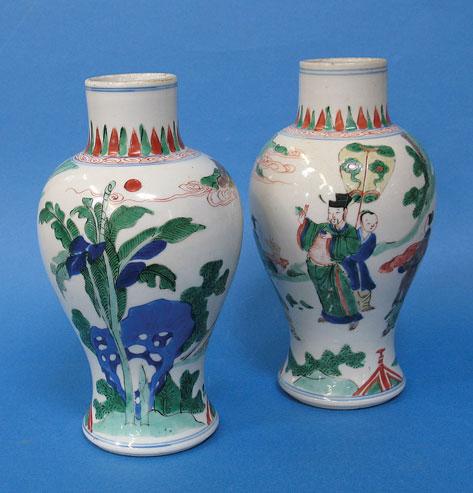 Appraisal: A PAIR OF CHINESE WOUCAI VASES of baluster form decorated